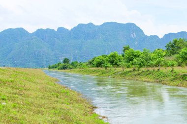 River flow, natural stream and the beautiful fresh green nature and mountain in the south of Laos 