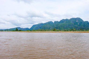 River flow, natural stream and the beautiful fresh green nature and mountain in the south of Laos 
