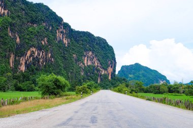 Road trip, beautiful green nature, rice paddy and mountain in the south of Laos, Khammuane province 