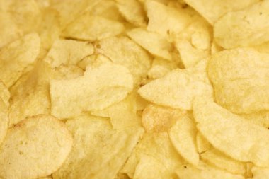 Yakından bakıldığında, tüm felsefe projeleri için kesinlikle mükemmel olan altın ve çıtır patates cipsleri sergilenmektedir.