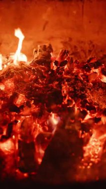 A vivid and captivating display of glowing embers and bright, dancing flames, showcasing inherent warmth and energy