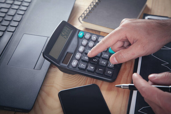 Businessman using calculator. Accounting. Business