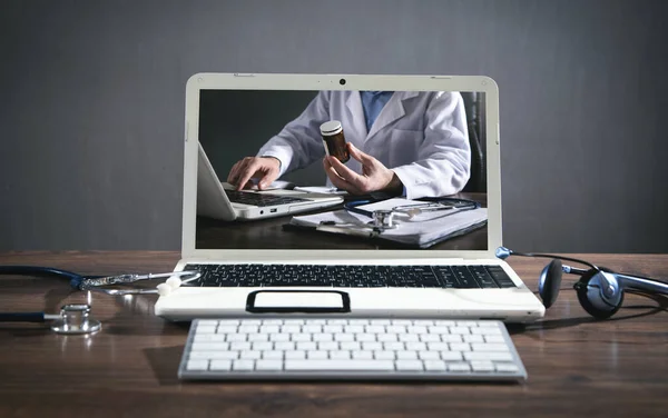 Laptop computer, stethoscope, headset. Online doctor. Telemedicine concept