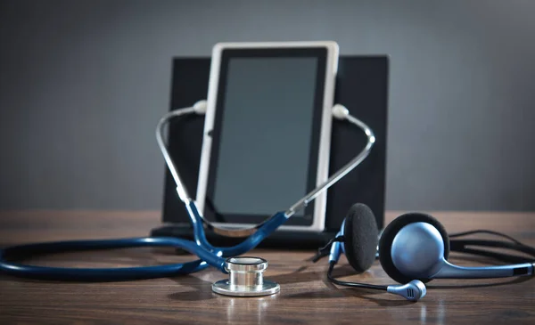Tablet, stethoscope, headset. Online doctor. Telemedicine concept