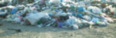 Defocused view of garbage at the outdoors.  clipart