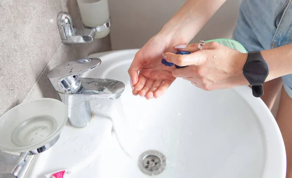 Woman cleaning hands. Hygiene. Washing hands