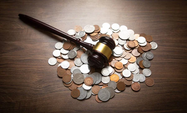 stock image Stack of coins with judge gavel.