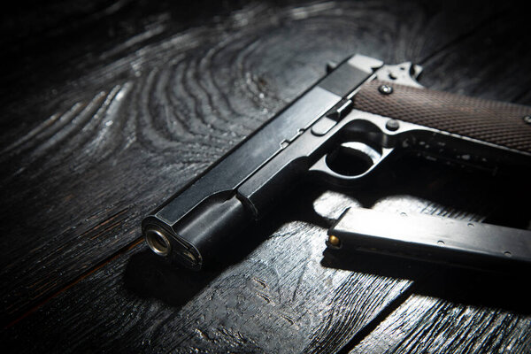 Pistol on the dark background.