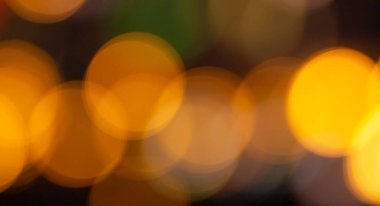 Bokeh odaklanmış ışıklarla soyut arkaplan.