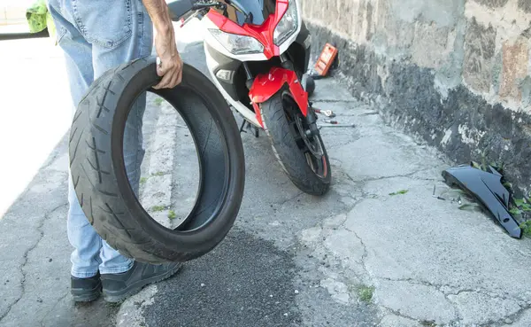 Man changing motorcycle tire. Sport. Hobby