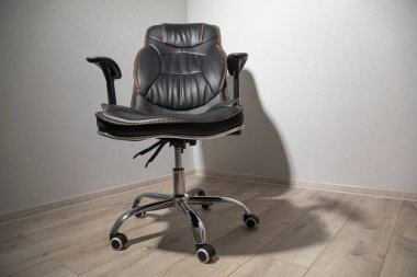 Black office chair at the office room. clipart