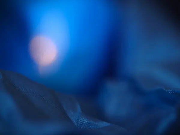 Mavi kumaşın soyut dokusu, tekstil arkaplanı