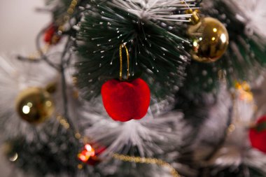 Close-up of balls on the Christmas tree with neutral background. Brazilian Christmas. Tree decoration. New year concept. Tree concept.	