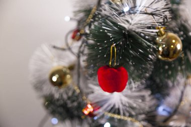 Close-up of balls on the Christmas tree with neutral background. Brazilian Christmas. Tree decoration. New year concept. Tree concept.	