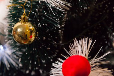 Close-up of balls on the Christmas tree with neutral background. Brazilian Christmas. Tree decoration. New year concept. Tree concept.	