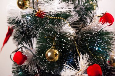Close-up on the Christmas tree with neutral background. Brazilian Christmas. Tree decoration. New year concept. Tree concept.	