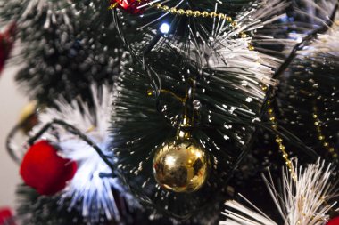 Close-up on the Christmas tree with neutral background. Brazilian Christmas. Tree decoration. New year concept. Tree concept.	