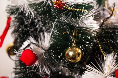 Close-up on the Christmas tree with neutral background. Brazilian Christmas. Tree decoration. New year concept. Tree concept.	
