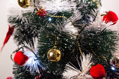 Close-up on the Christmas tree with neutral background. Brazilian Christmas. Tree decoration. New year concept. Tree concept.	