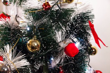 Close-up on the Christmas tree with neutral background. Brazilian Christmas. Tree decoration. New year concept. Tree concept.	