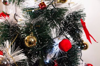 Close-up on the Christmas tree with neutral background. Brazilian Christmas. Tree decoration. New year concept. Tree concept.	