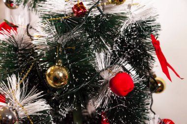 Close-up on the Christmas tree with neutral background. Brazilian Christmas. Tree decoration. New year concept. Tree concept.	