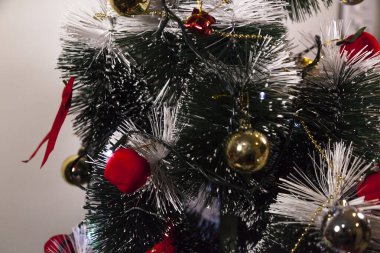 Close-up on the Christmas tree with neutral background. Brazilian Christmas. Tree decoration. New year concept. Tree concept.	