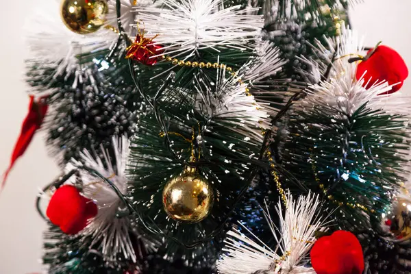 Close-up on the Christmas tree with neutral background. Brazilian Christmas. Tree decoration. New year concept. Tree concept.	