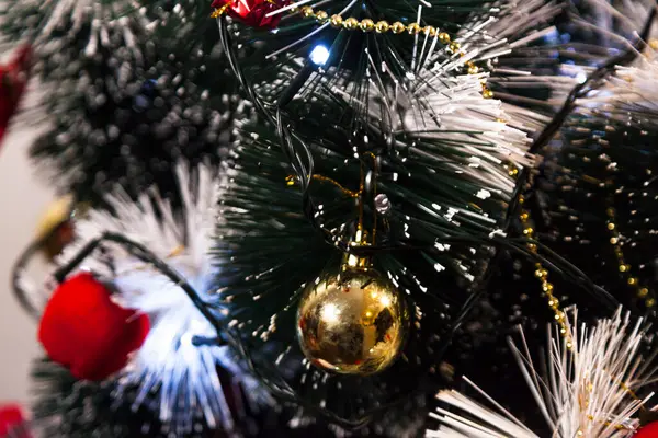 Close-up on the Christmas tree with neutral background. Brazilian Christmas. Tree decoration. New year concept. Tree concept.	