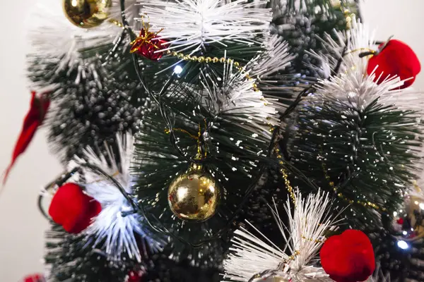 Close-up on the Christmas tree with neutral background. Brazilian Christmas. Tree decoration. New year concept. Tree concept.	