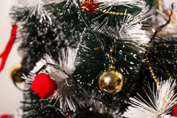 Close-up on the Christmas tree with neutral background. Brazilian Christmas. Tree decoration. New year concept. Tree concept.	