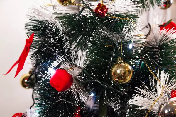 Close-up on the Christmas tree with neutral background. Brazilian Christmas. Tree decoration. New year concept. Tree concept.	
