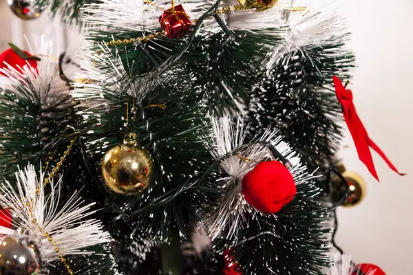 Close-up on the Christmas tree with neutral background. Brazilian Christmas. Tree decoration. New year concept. Tree concept.	