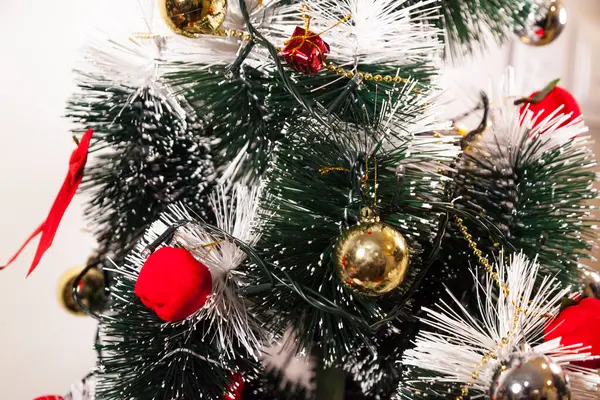 Close-up on the Christmas tree with neutral background. Brazilian Christmas. Tree decoration. New year concept. Tree concept.	