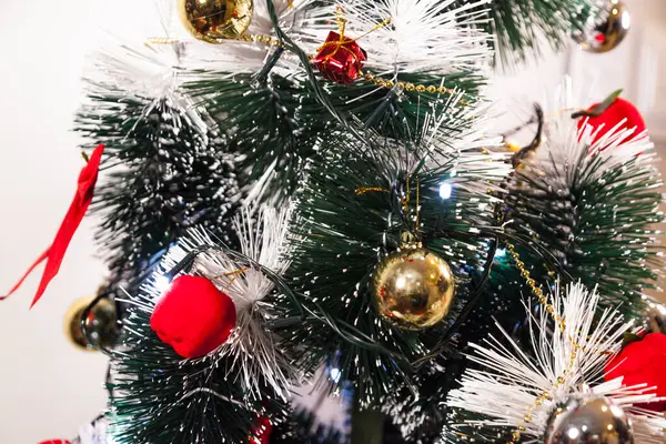 Close-up on the Christmas tree with neutral background. Brazilian Christmas. Tree decoration. New year concept. Tree concept.	