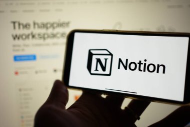 Roosendaal, The Netherlands - February 2, 2025: A mobile phone screen displaying the logo of Notion, an all-in-one customizable project management app, with the company website in the background. clipart