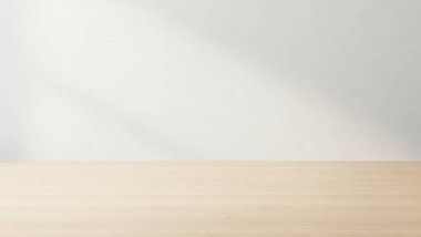 Temiz ve minimalist bir düzenek. Hafif ahşap bir masa ve düz beyaz bir duvar arka planı var.