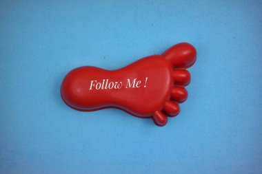 Red Foot Shaped Toy Object with Text 