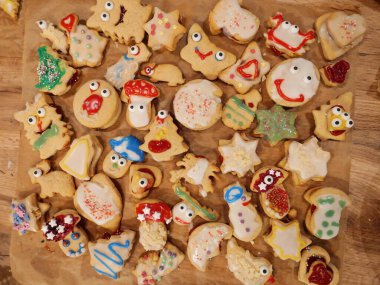 Cookies baked and decorated by children. Homemade cookies baked and decorated by kids, perfect for Christmas, birthdays, and parties. A creative, fun, and delicious treat.  clipart