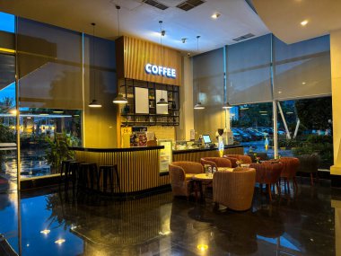 tangerang, indonesia - june 22, 2025 : a coffee shop located in the lobby of a hotel in tangerang city 