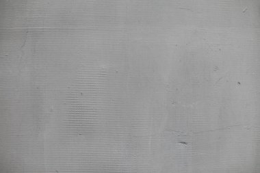 Kalıplaşmış beton duvar yüzeyine yakın çekim, açık gri tonlarda pürüzsüz bir son, tasarım için mükemmel arka planlar veya mimari ilham
