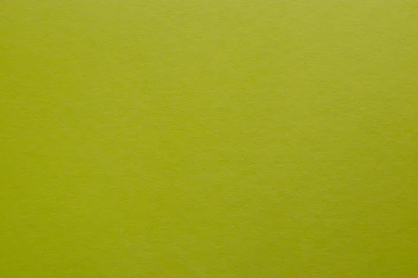 黄緑色の着色された紙シートの背景 — ストック写真