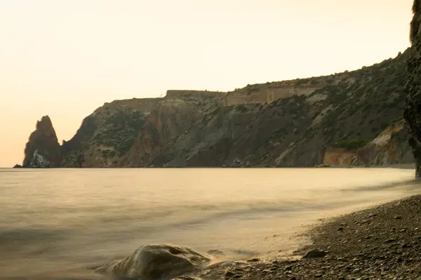 deniz kıyısında gün batımı