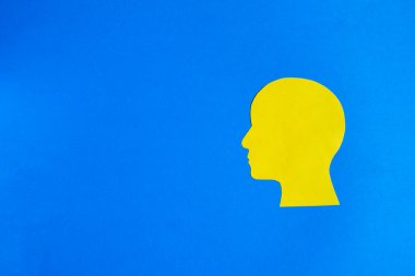 Mavi Arkaplanda Sarı İnsan Başı Silueti