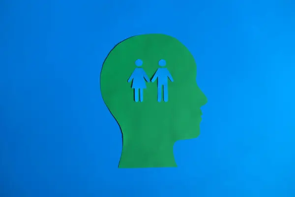 İçinde bir çift el ele tutuşmuş siyah beyaz bir kağıt kesiği..