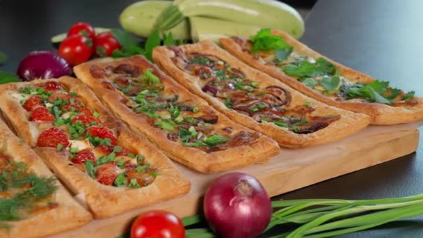 Snacks Made Puff Pastry Various Fillings Herbs Black Table Decorated — Stock Video