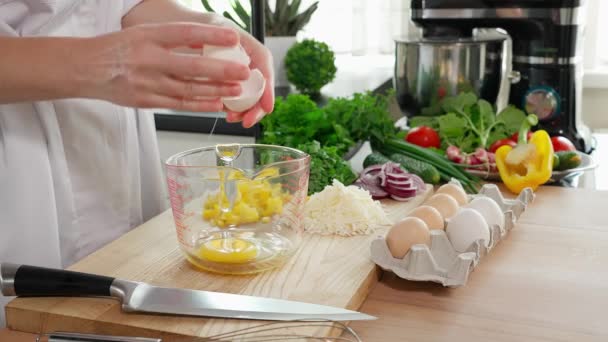 Woman Hands Breaking Eggs Glass Measuring Cup Preparing Healthy Breakfast — Stock Video