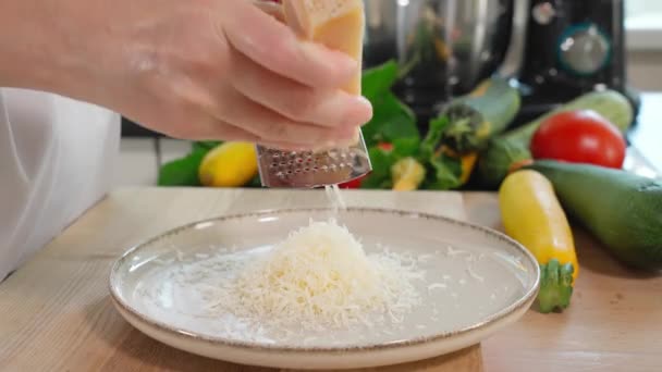 Close Chef Hands Grating Parmesan Cheese Fine Grater Plate Wooden — Stock Video