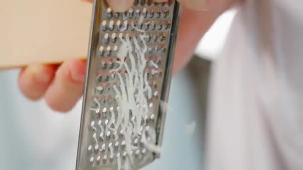 Close Parmesan Cheese Being Grated Fine Grater Macro Front View — Stock Video