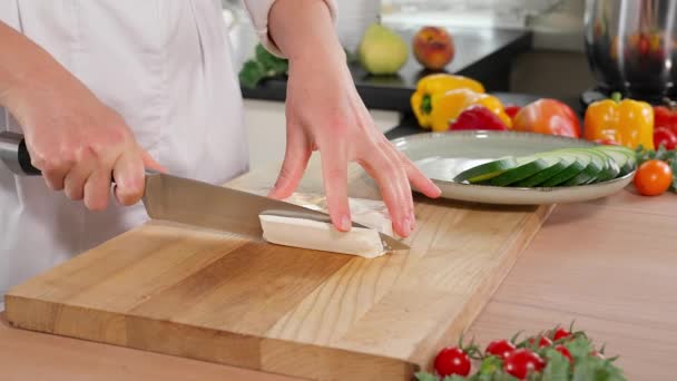Chef Hands Cut Feta Cheese Strips Wooden Dock Vegetables Background — Stock Video